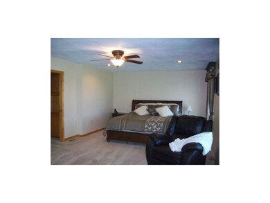 Master bedroom with room for sitting/TV area.