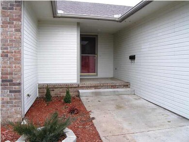 The wide sidewalk and sheltered entry help guests.