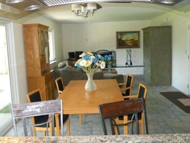Dining Area with Slider to Backyard. Also Stools for Breakfast Nook.