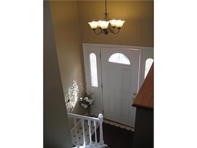 Entry/Foyer. steps up to 4 bedrooms, living room, 