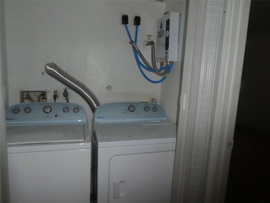 Tankless water heater.  Washer and dryer are NOT i