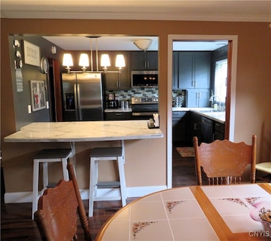Island showing the kitchen from the dining space.