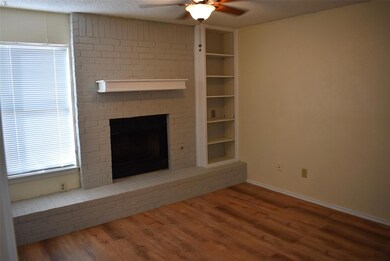 Unfurnished living room with a ceiling fan, wood 