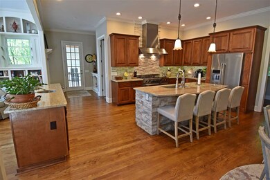 The very spacious Kitchen includes custom cabinetr