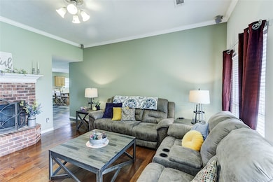 Living room with hardwood / wood-style floors, cei
