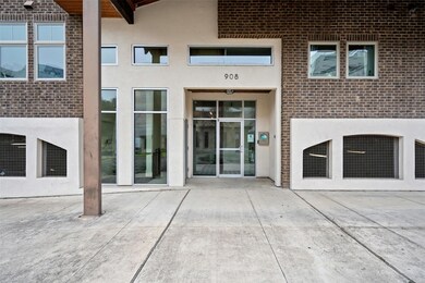 Property entrance featuring stucco siding and a p
