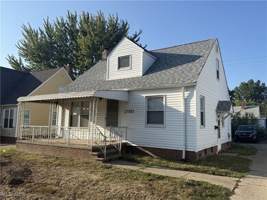 View of front facade featuring covered porch, roof with shingles, and a chimney