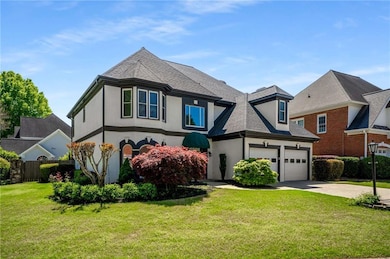View of front of property with concrete driveway, 