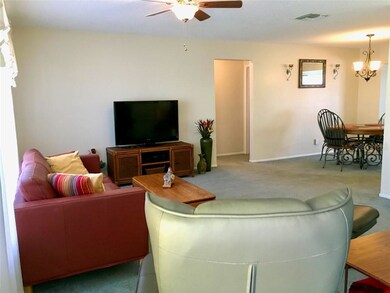 Living room view to dining room and entry to hallw