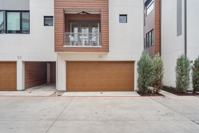 View of front of house featuring a balcony, concr