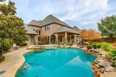 An oasis in your own backyard! Your swimming pool features a beach entry, decorative stone coping with gardens and an in ground hot tub.