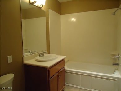 Bathroom featuring toilet, bathtub / shower combin