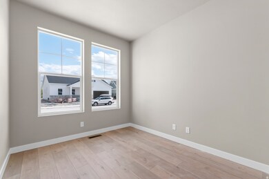 Unfurnished room with baseboards and light wood-style floors