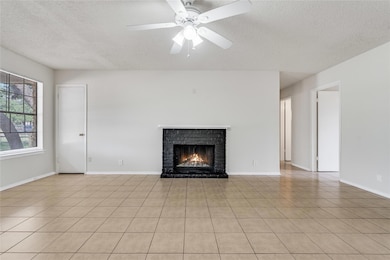 Unfurnished living room with a textured ceiling, 