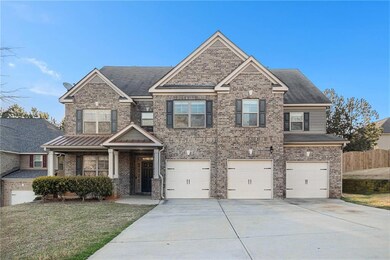 Craftsman house featuring driveway, a garage, brick siding, and a porch