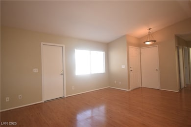 Entryway featuring baseboards and wood finished fl