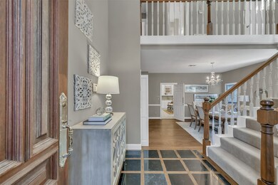 Beautiful inlayed marble & wood floor in foyer.