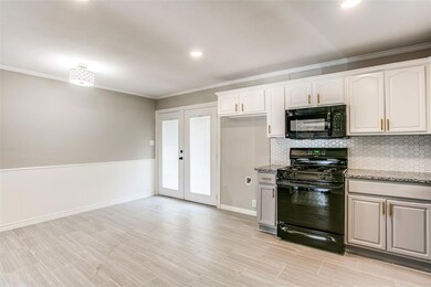 Can lighting keep the space extra bright and french doors lead out to the back yard patio.