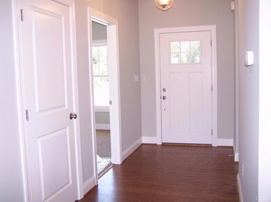 Enter into the foyer with coat/storage closet. Hom