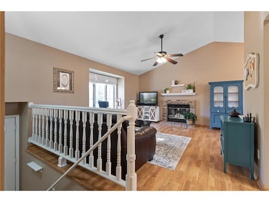 Upstairs an open living room leads to a charming k