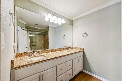 Full bathroom featuring double vanity, a sink, ti
