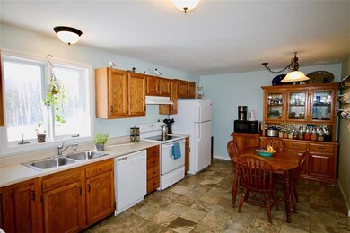 The kitchen with oak cabinets above...