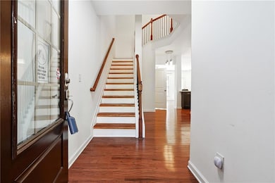 Foyer entrance featuring dark wood finished floors