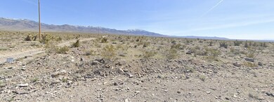 View of mountain backdrop featuring a desert lands