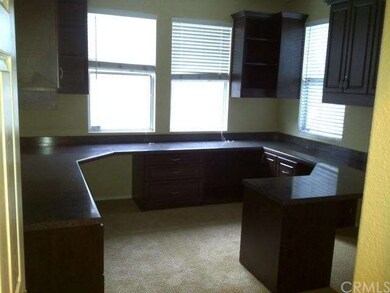 Office / study room with built-in cabinets.