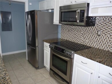 The kitchen has been updated with  granite and sta