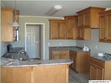 LARGE KITCHEN WITH CUSTOM CABINETS & TILE FLOORING!