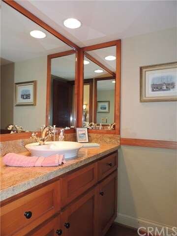 Downstairs half bath has the same granite as kitch