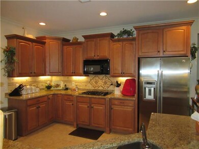 Great kitchen with tons of cabinets, granite countertops, tile backsplash, stainless appliances.