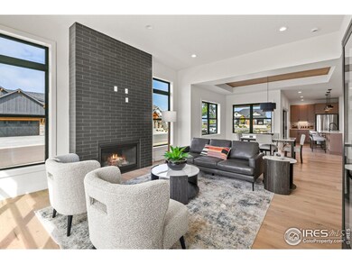 Sophisticated living room anchored by a premium fireplace insert and a dramatic ceiling to floor mantel.