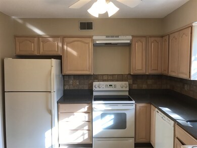 The kitchen has new ceramic tile flooring, new cou