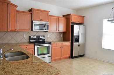 Kitchen w/Granite and SS Appliances