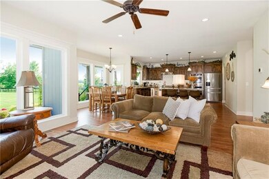 VIEW FROM GREAT ROOM TO KITCHEN AND BREAKFAST AREA