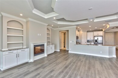 Open Living Area With Fireplace, Built-In Shelves,