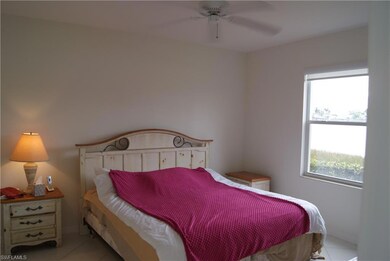 Bedroom with ceiling fan and light tile patterned 