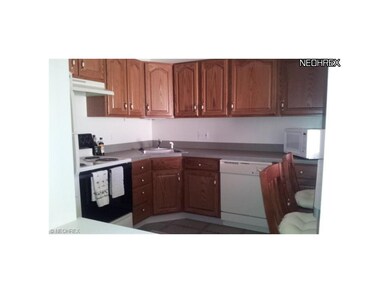 A spacious kitchen, with plenty of cabinetry.  App