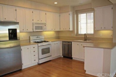Large eat-in kitchen has smooth surface counters a