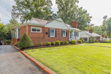 Single-level, brick rancher with paved driveway in Bryan Park!