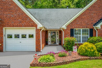 Front view of home with touch up to walkway to front door