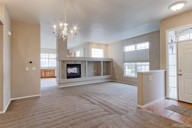 Living room with 2 sided fireplace and was just cleaned and serviced. Carpets have just been cleaned.