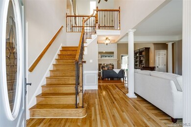 The foyer boasts 21 ft ceilings and gorgeous new h