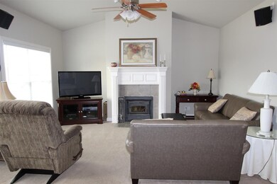 The Great Room offers Cathedral Ceilings and a bea