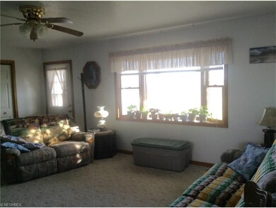 Living room showing bay window and inside of front