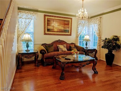 Living room with a notable chandelier, ornamental