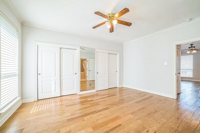 Unfurnished bedroom featuring two closets, light 