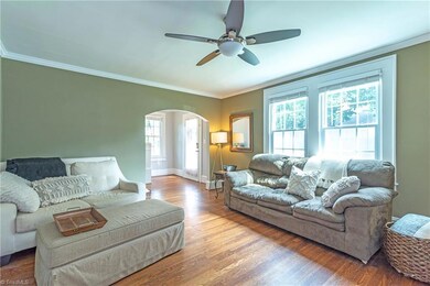 Arched doorway into the living room from the foyer adds that Ardmore Charm.